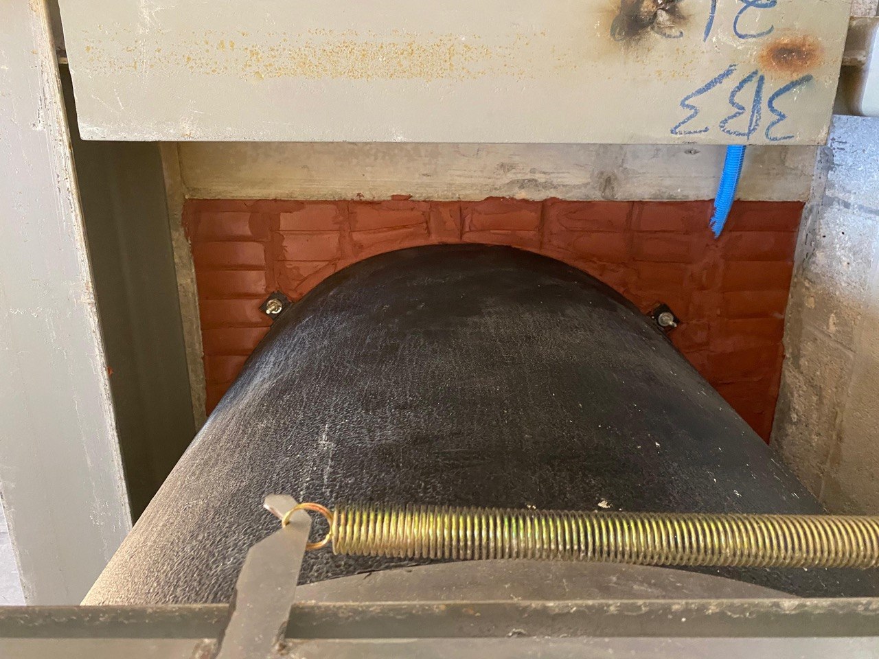 Large pipe penetration with red firestop